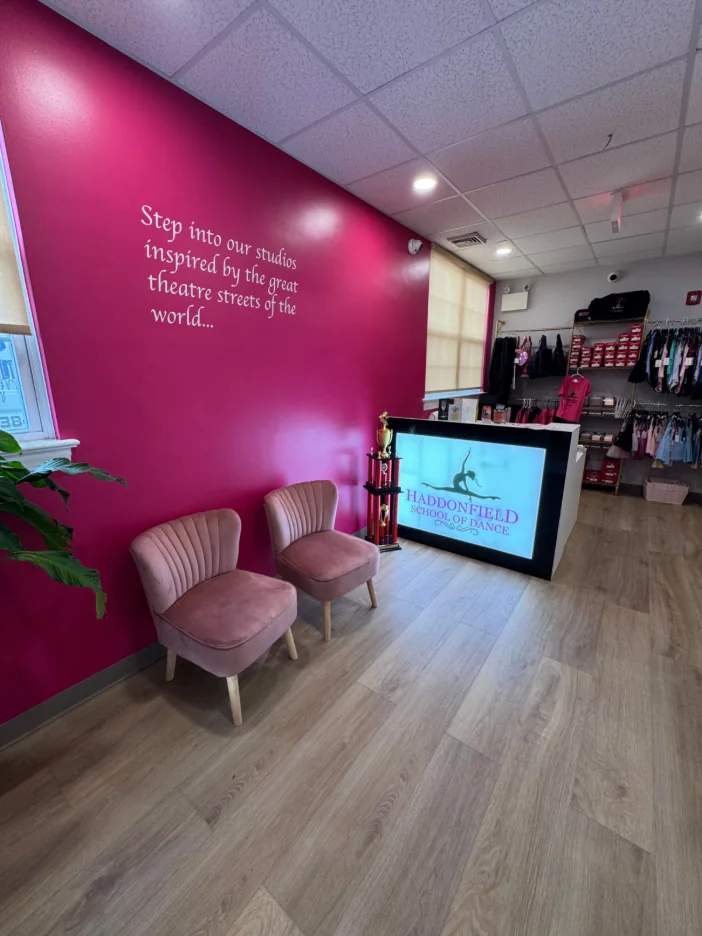 A warm welcome in our signature magenta lobby.